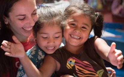 Happy children with their teacher at one of Projects Abroad's volunteer teaching placements in Costa Rica